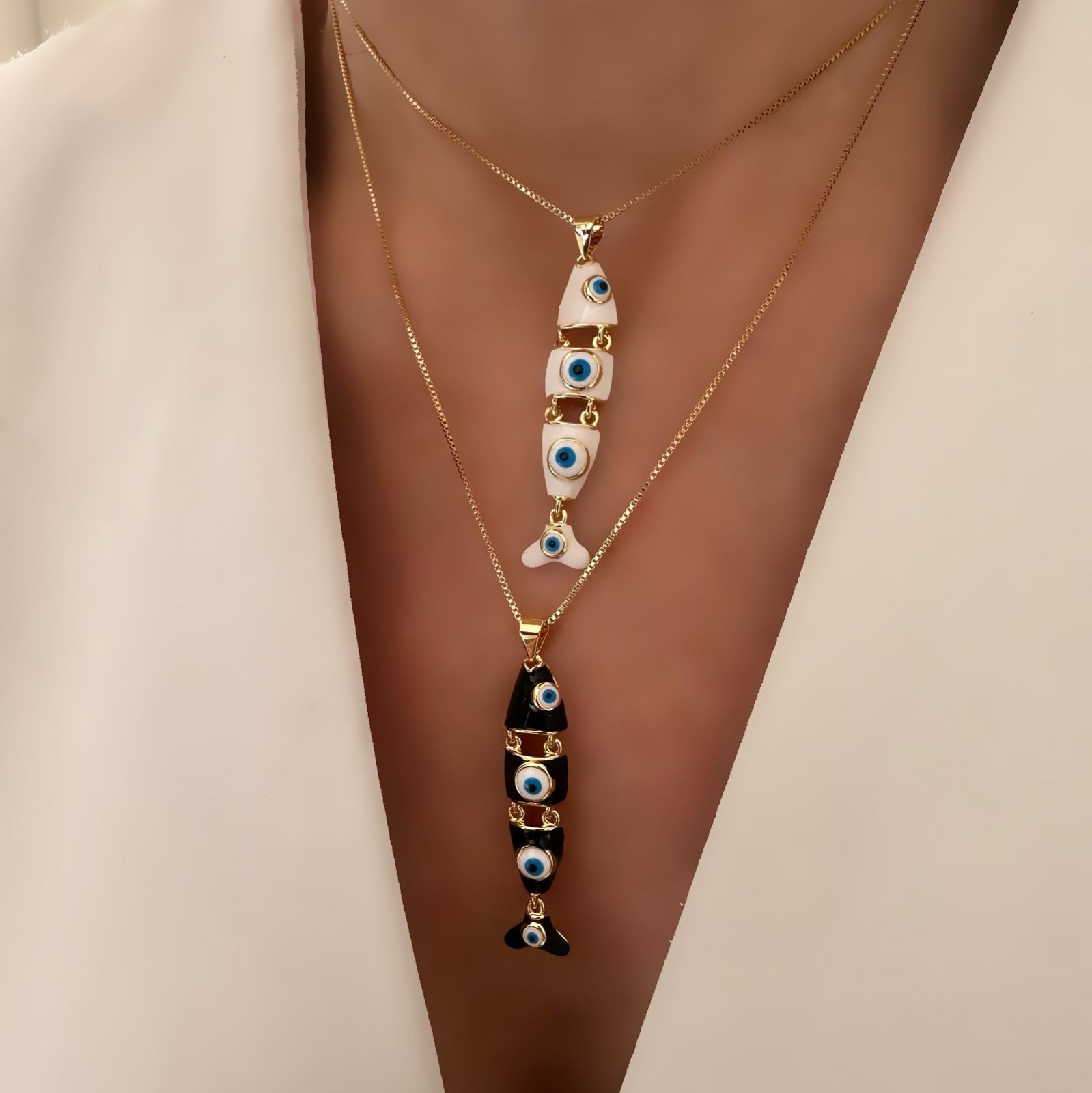 Cadena fish evil eye black o white.